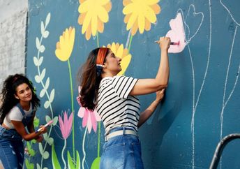 Painting a mural at a school.