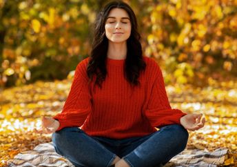 Woman meditating in nature.