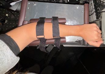 A doctor checks a patient’s blood sugar level.