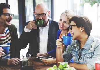 People meet together in a coffee shop.