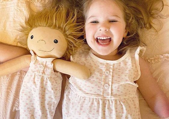 Girl playing with her customized doll thanks to Amy Jandrisevits of A Doll Like Me