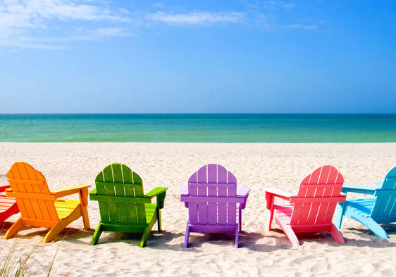 Colored chairs on a scenic shore suggesting positive potential.
