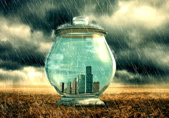 City buildings in a glass jar to emphasize protection from heavy rain.