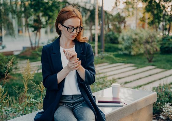 A woman checking her heart rate.