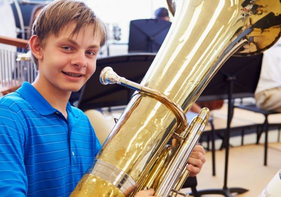 Student playing a tuba.