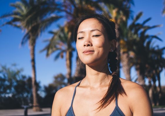 A woman with closed eyes rests.