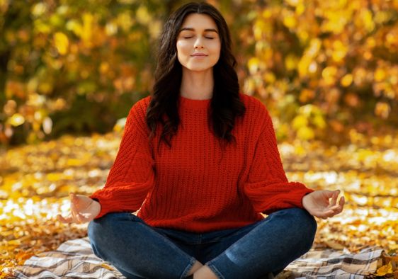 Woman meditating in nature.