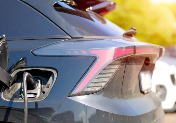 Electric vehicle charging in a residential neighborhood.