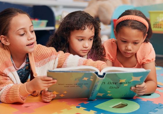 Girls reading books together.