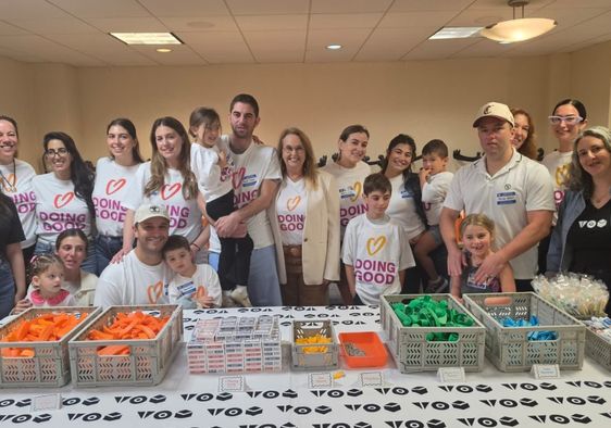 Shari Arison stands with Good Deeds Day volunteers.