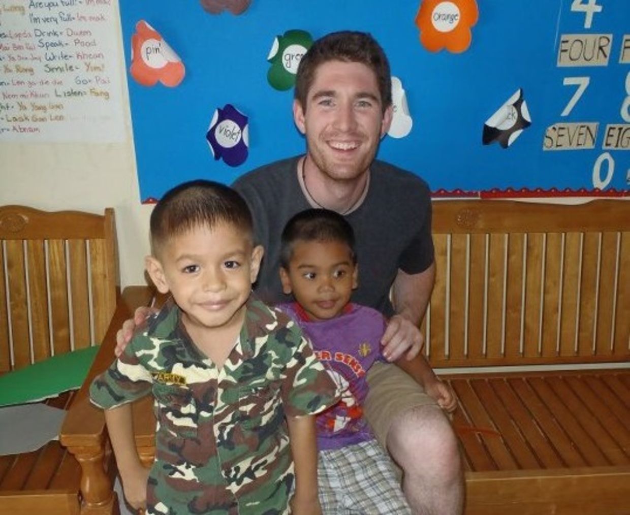 Christian Clark with children at daycare in Thailand (courtesy of Projects Abroad)