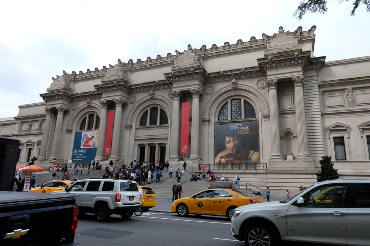 Cars drive by the Metropolitan Museum of Art in New York City. (Warisa K / Shutterstock.com)