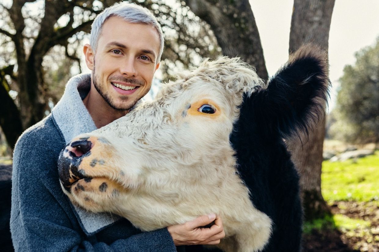 Nathan Runkle poses with a rescued cow