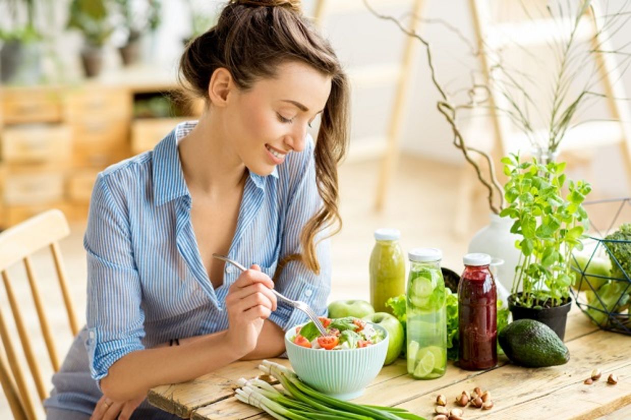 Young woman eating a healthy salad