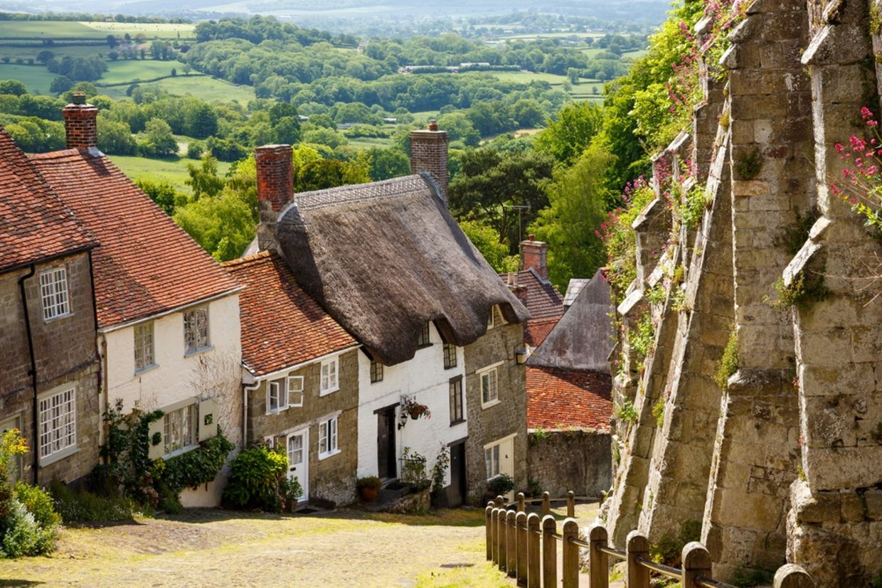 Famous view of Picturesque cottages on cobbled street at Gold Hill, Shaftesbury Dorset England UK Europe