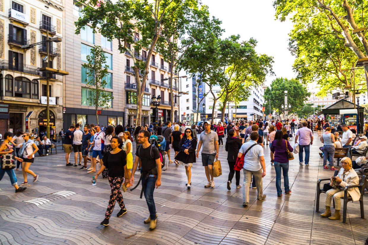 Hundreds of tourists from all over the world visit and stroll the streets of Barcelona