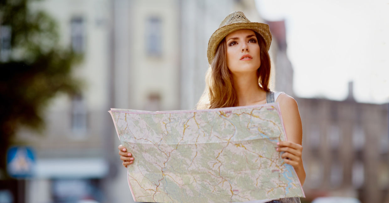 Best Jobs in the World - A woman is looking at a map while traveling abroad. (Shutterstock)