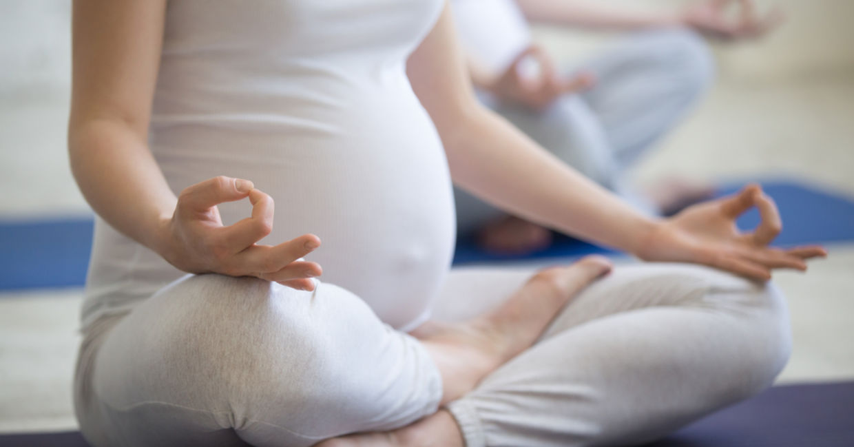 A pregnant woman meditating