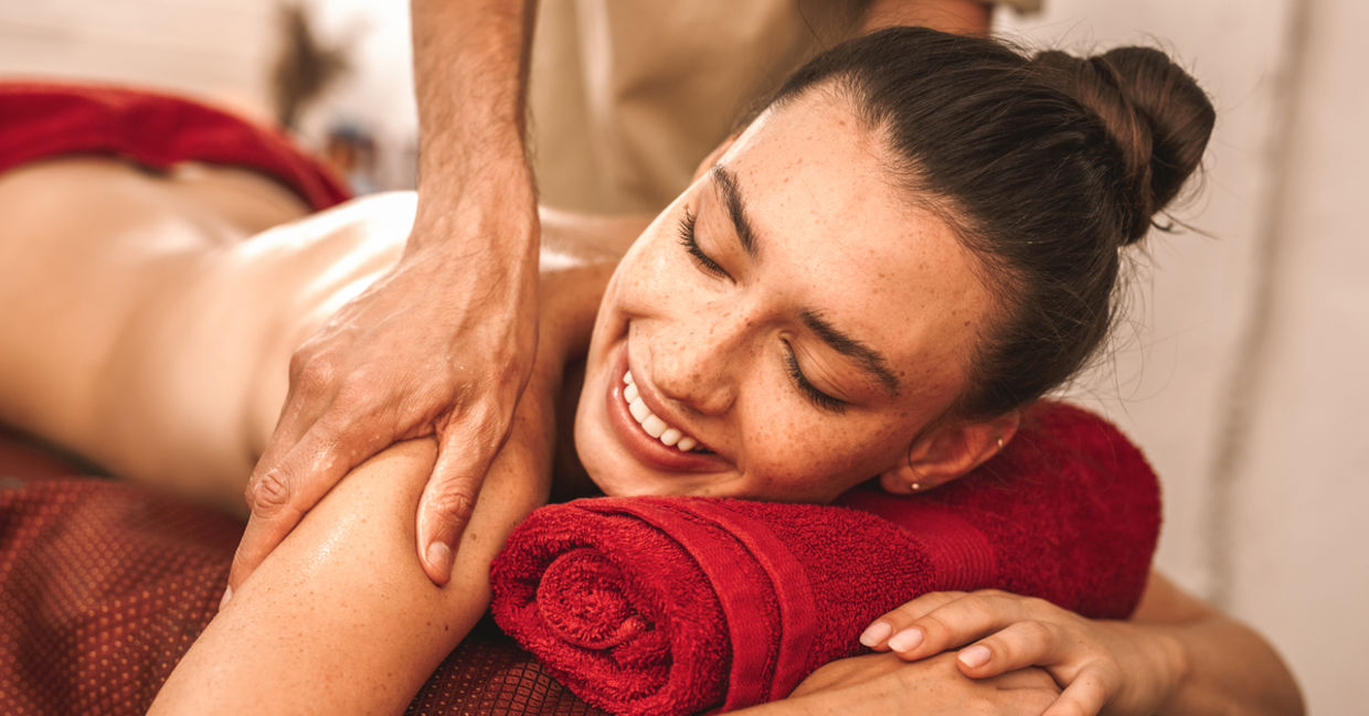 Woman getting an Abhyanga massage.