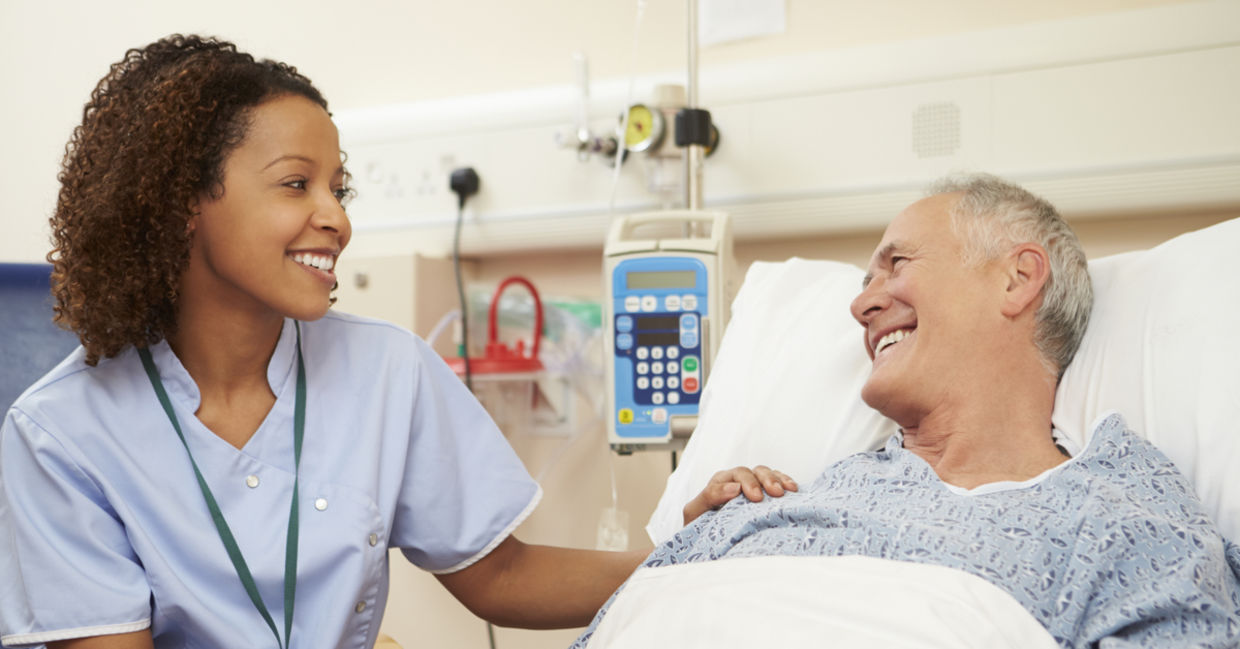 Nurse at a hospital taking care of a patient.