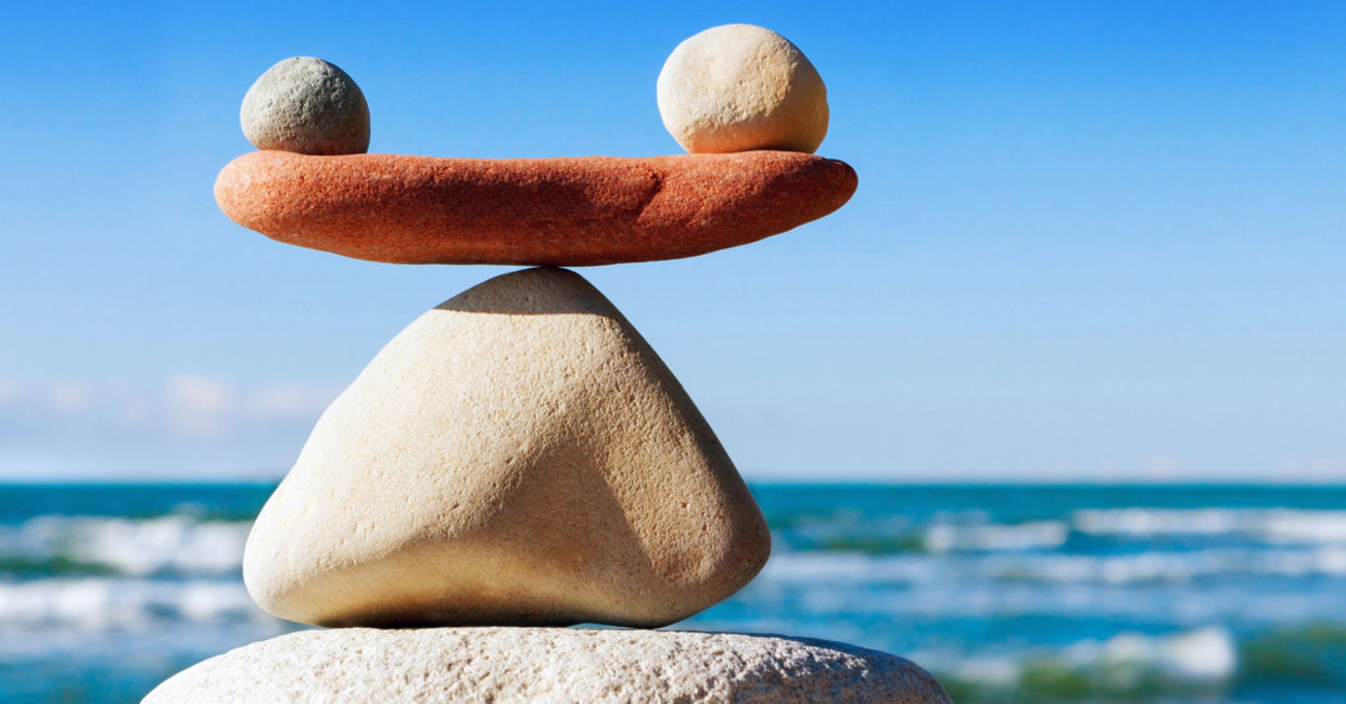 A photograph of stones in balance to convey work life balance