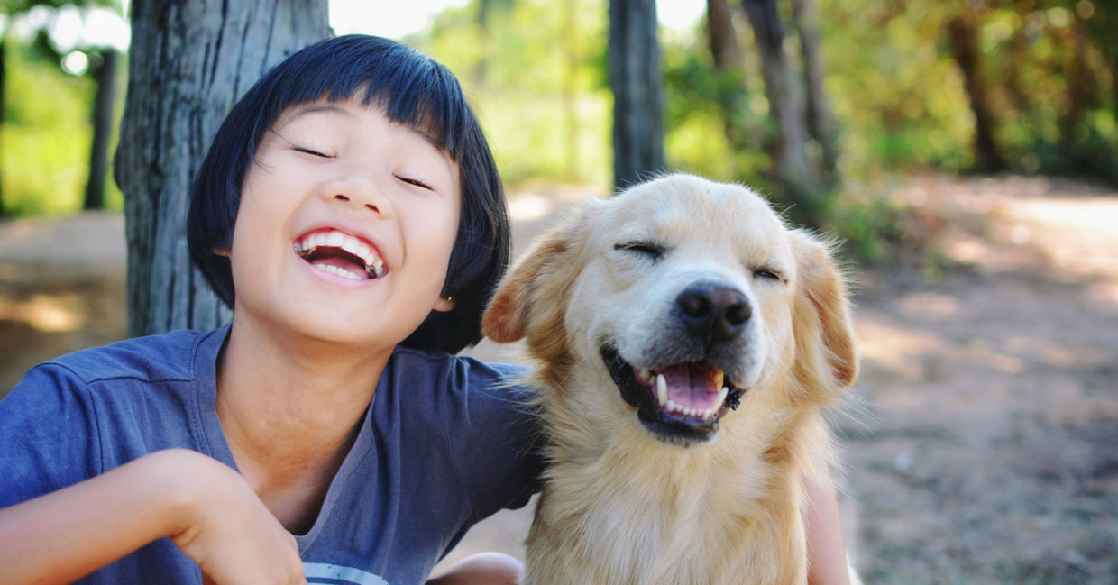 Happy child with adopted dog.