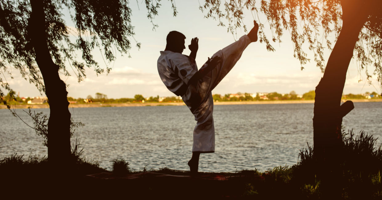 Practicing karate at sunset