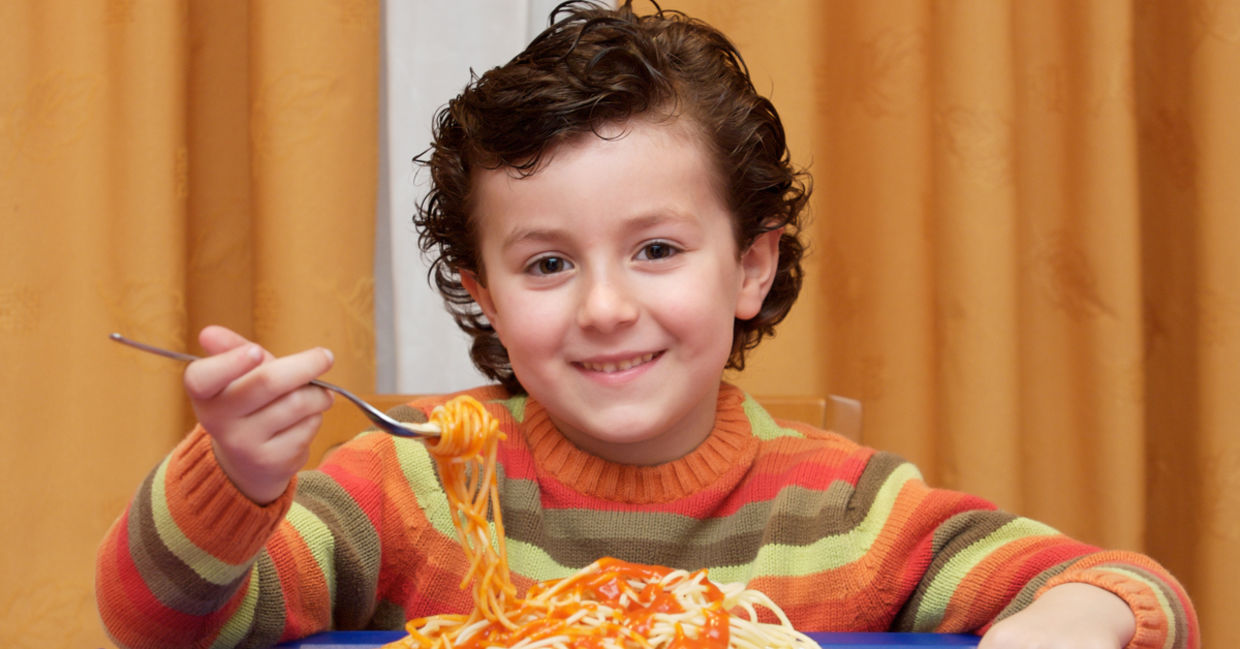 This boy is eating a healthy and nutritious kid-friendly meal.