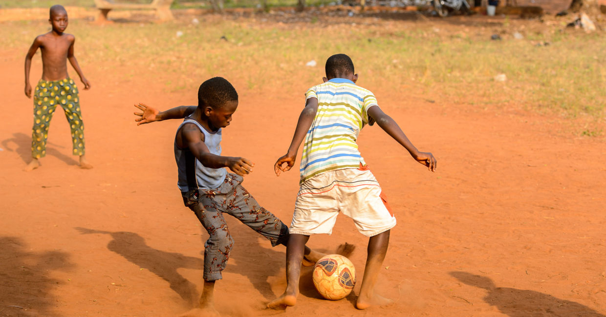 Children playing football.