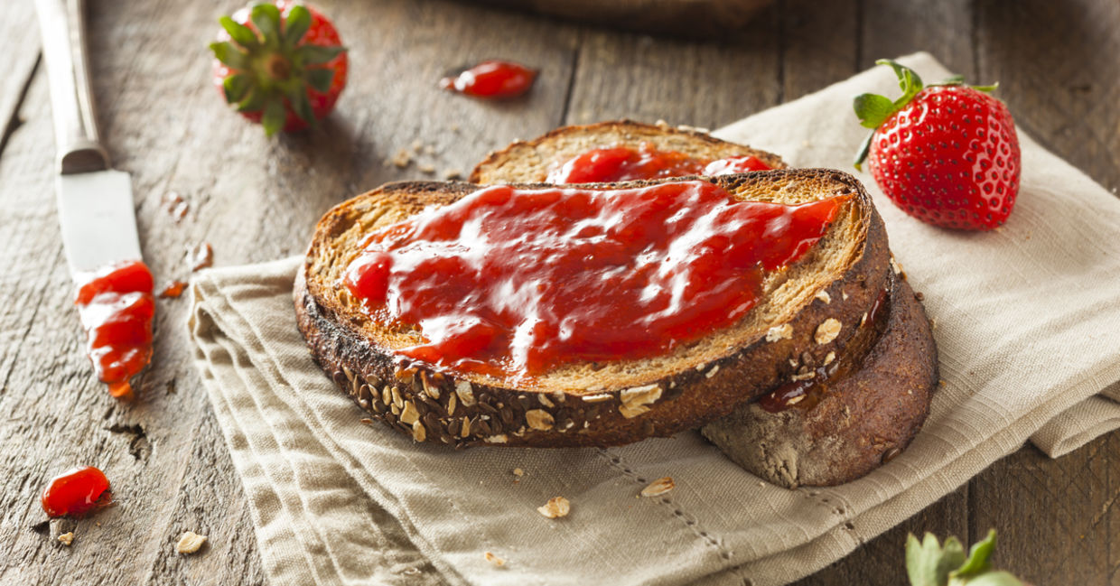 Strawberry preserves on whole grain bread is full of fiber.