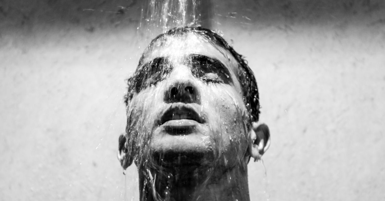 A man enjoying a refreshing cool shower