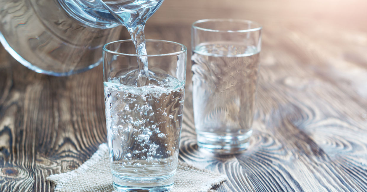 Glass of water on a wooden table