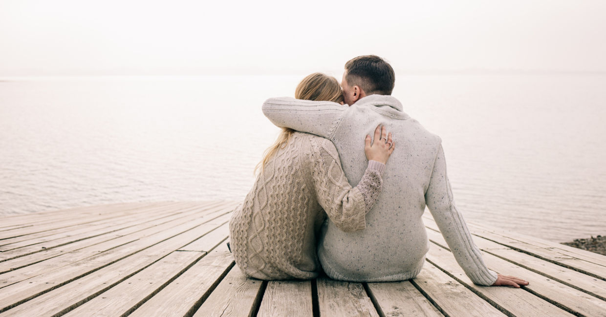 Couple hugging on a pier