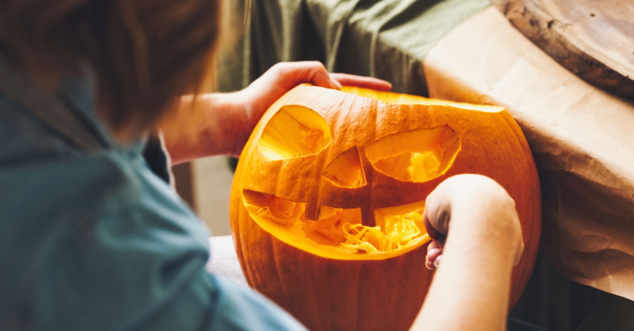 Carving a Halloween jack-o-lantern.