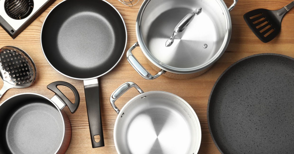 A selection of kitchen cookware including pots, pans, and utensils.