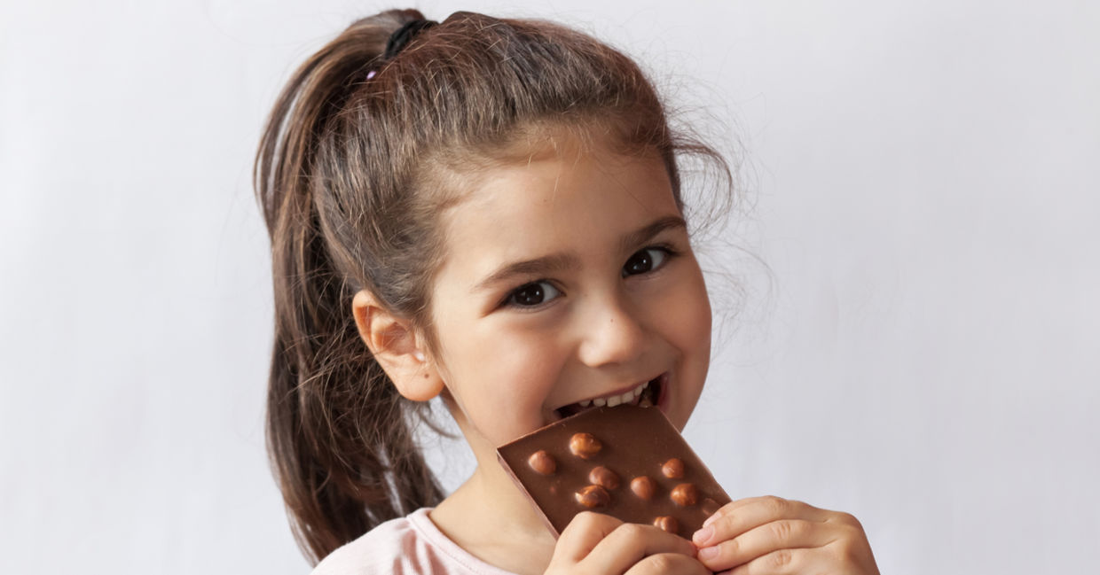 Girl enjoying chocolate.