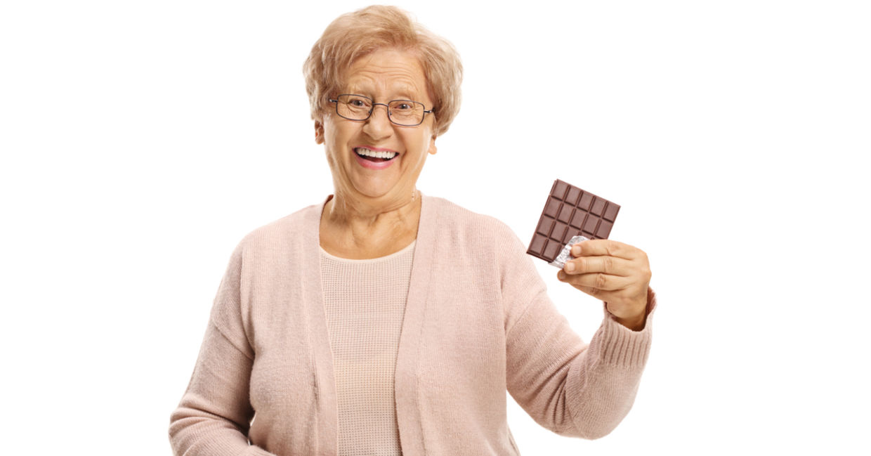 Senior woman enjoying chocolate.