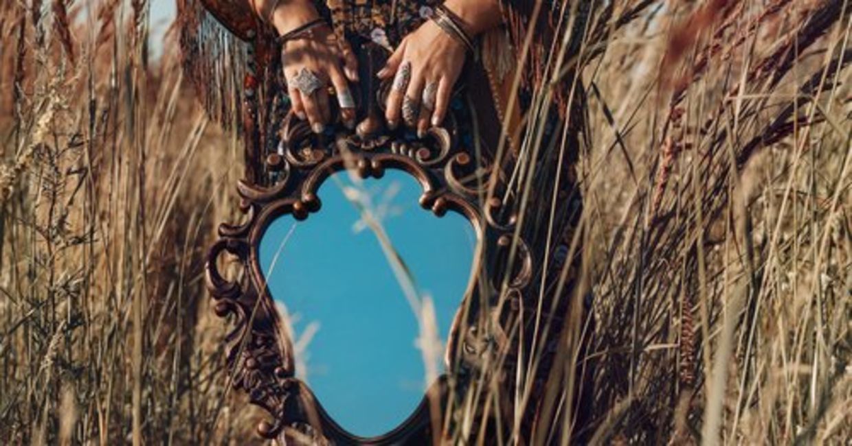 A heyoka empath is holding a mirror as she reflects the truth of others to the world.