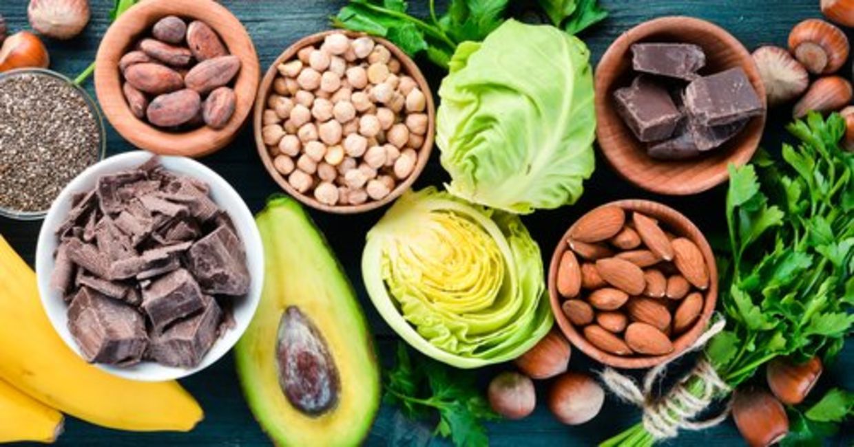Foods that are rich in magnesium, including dark chocolate, nuts, and avocado.