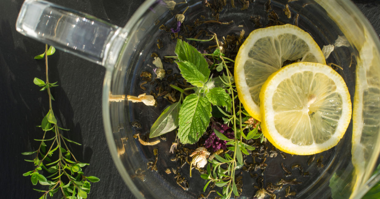A calming mix of lemon balm and lemon slices in a teacup.