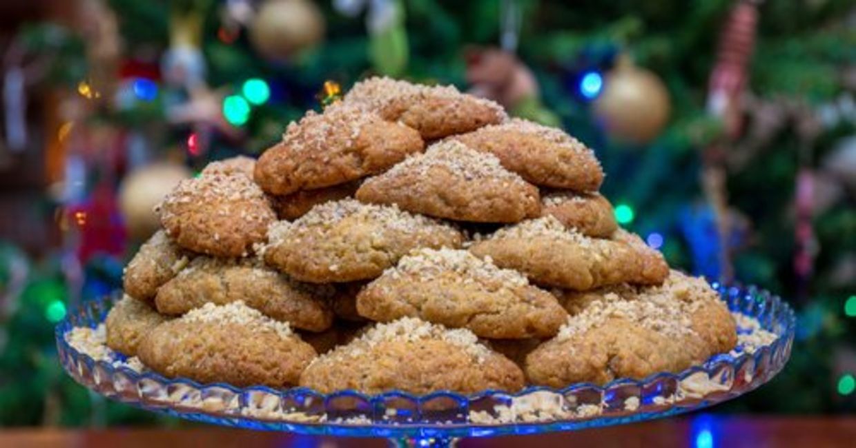 Sugar-coated honey cookies with walnuts is a Greek Christmas treat called melomakarona.