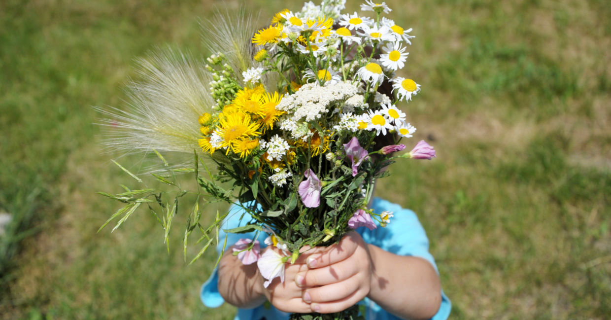 Child with flowers.