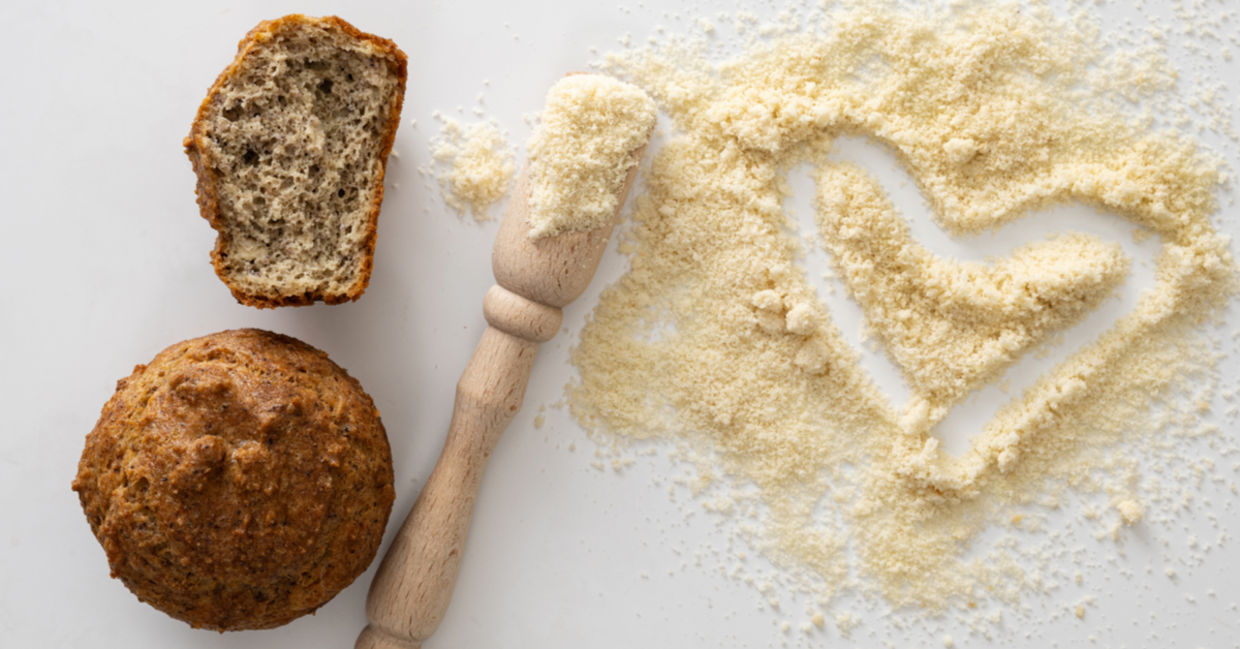 Healthy, gluten-free almond flour beside muffins.