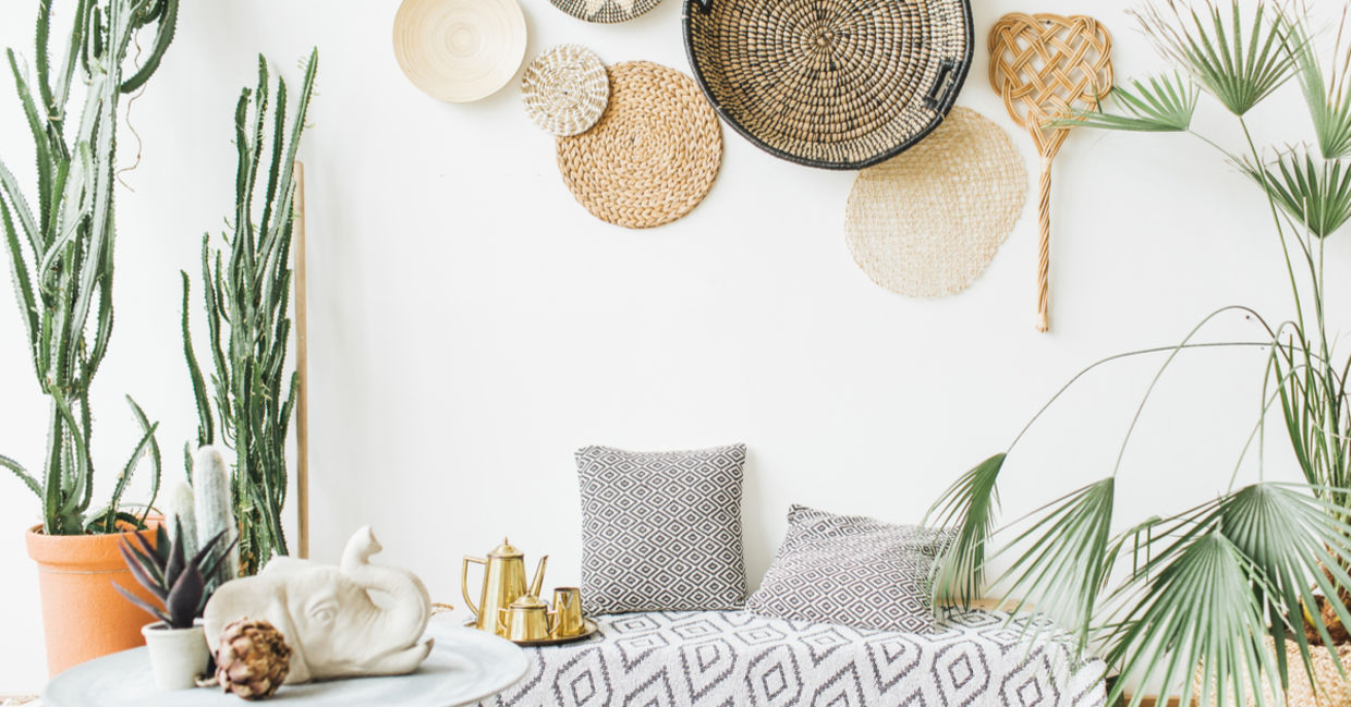 Manifest travel to faraway places by using decorative woven plates, succulents, and exotic accessories.