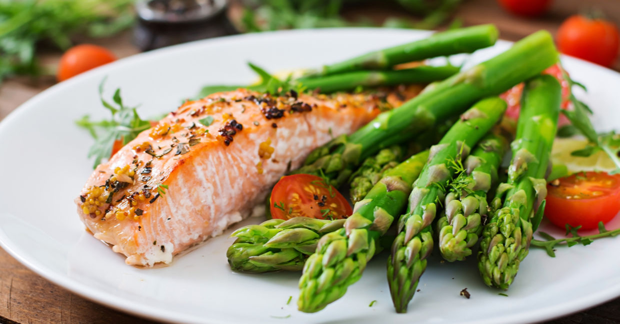 Baked salmon served with healthy asparagus.