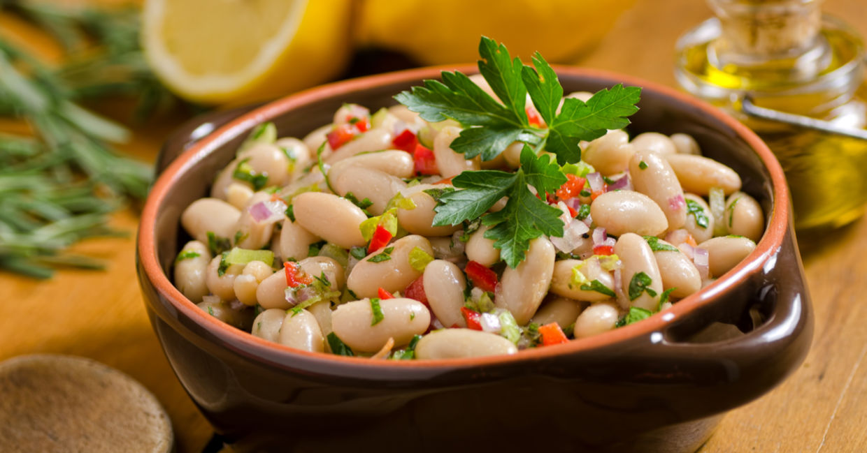 White bean salad with greens and avocado.