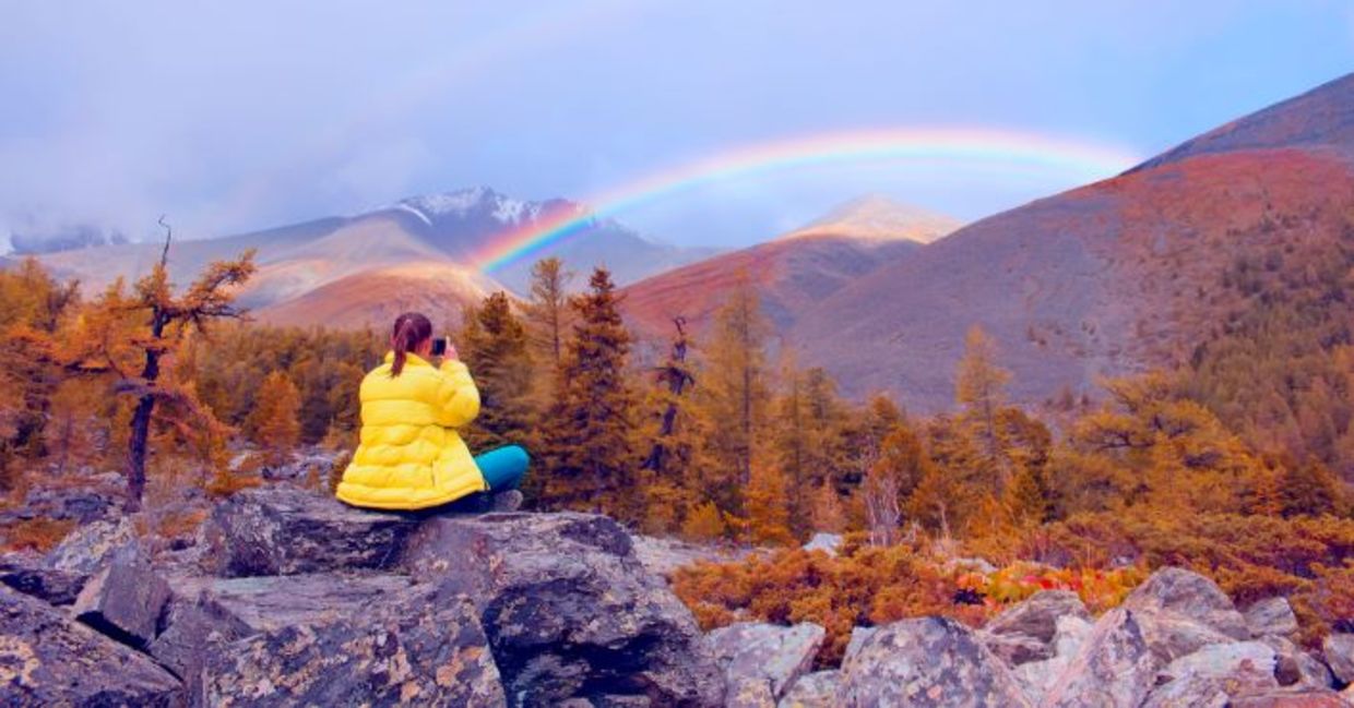 Finding courage while seated in nature admiring a rainbow.