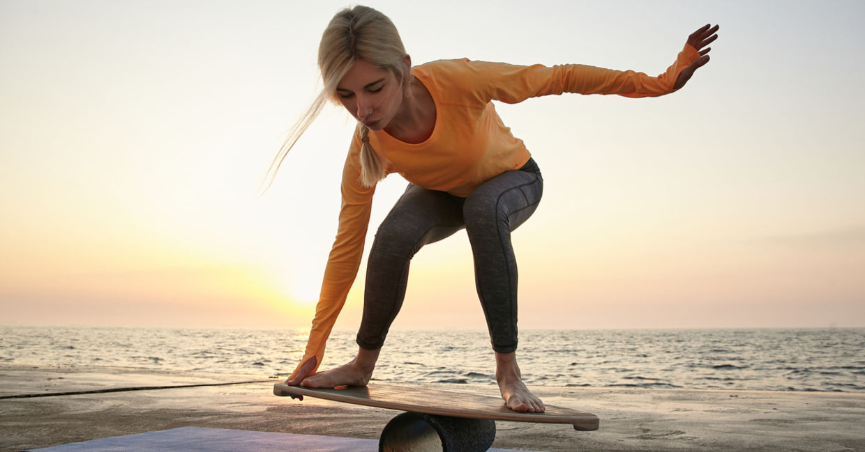 Young woman trying to keep her balance.