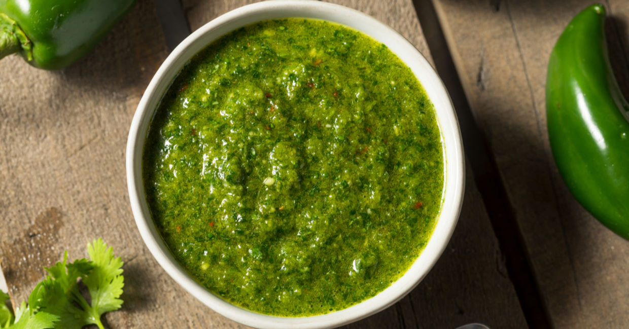 Classic Middle Eastern zhug sauce shown with cilantro and jalapeno peppers.