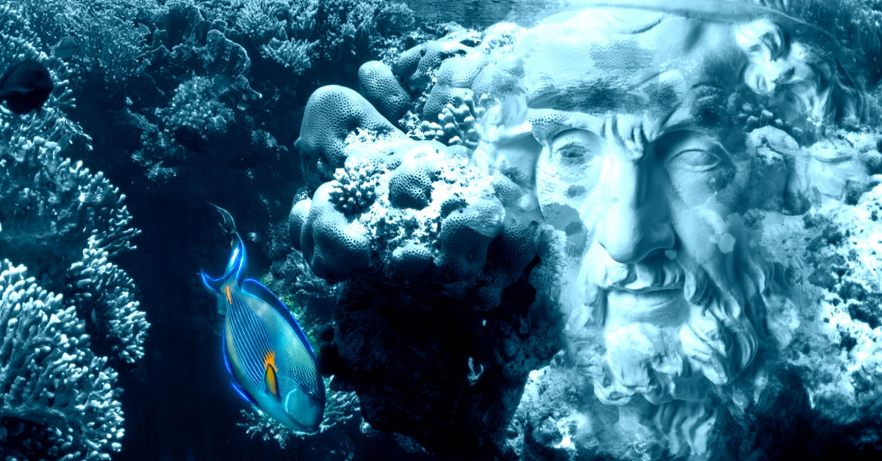 Face of ancient status on an underwater background with corals and fish.